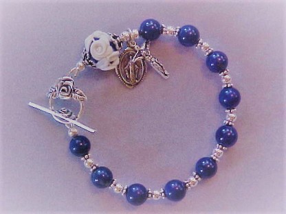 beaded sterling silver rosary bracelet with 8mm Lapis Lazuli and matching 10x13mm Cameo Rose Our Father, double rose clasp and small crucifix and medal dangles