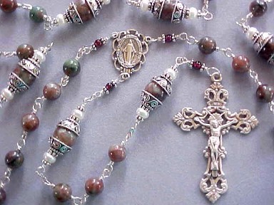 handmade sterling silver wire wrapped rosary with Kashgar garnet, button pearls and deluxe sterling silver crucifix and center