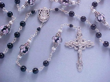 Black Tourmaline handmade rosary with lampworked floral glass. All sterling silver wire wrapped construction