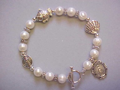 handmade Trinity bracelet with genuine freshwater pearls, fish and shell beads, dangle medal