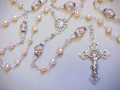 handmade wire wrapped sterling silver rosary with peach freshwater pearls and lampworked glass