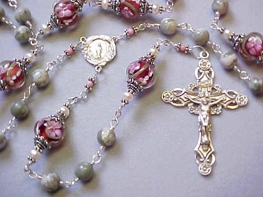 sterling silver wire wrapped rosary with peace jade, lampworked glass and deluxe sterling silver crucifix and center